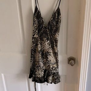 Black and beaded deep v ruffle skirt mini dress